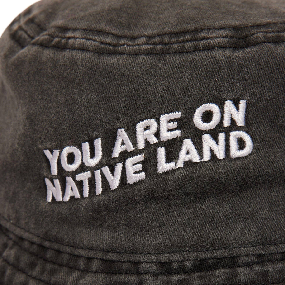 'YOU ARE ON NATIVE LAND' BUCKET HAT - BLACK